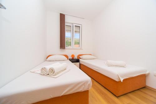 Postel nebo postele na pokoji v ubytování Apartment Dubrovnik Downtown