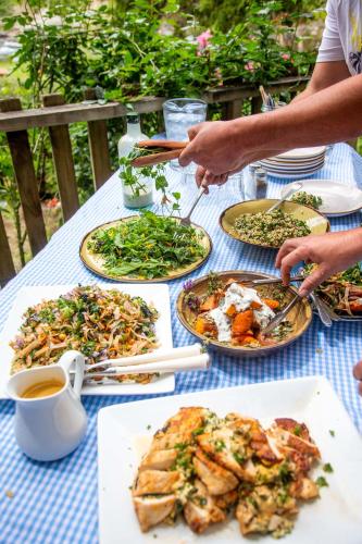 a table with plates of food on it at River Valley Lodge in Taihape