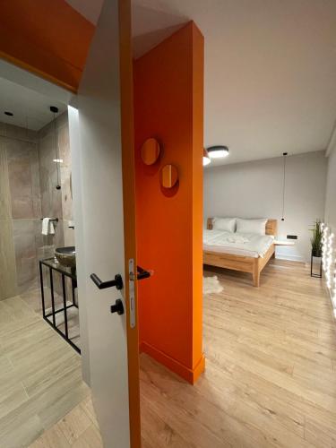 an open door to a bedroom with a bed in a room at ConnectIN Apartments in Pale