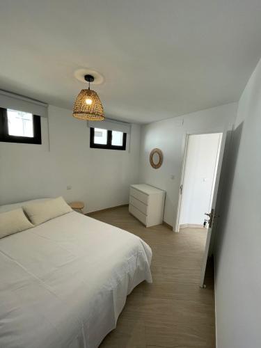 Кровать или кровати в номере Bungalow con vistas al mar