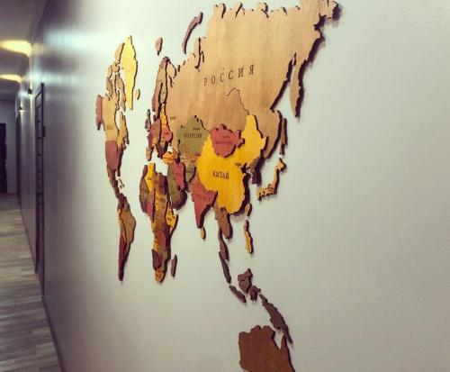 a map of the world on a wall at Ave hotel in Osh