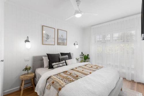 a white bedroom with a large bed and a window at Foxmount Estate - Astrid in Mount Gambier