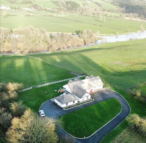 an aerial view of a house in a field at Cable Island Bed and Breakfast in Cork