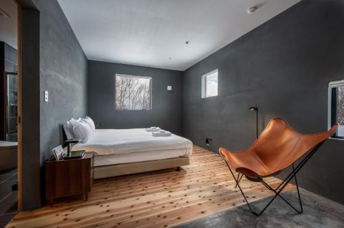 מיטה או מיטות בחדר ב-Foxwood B by H2 Life