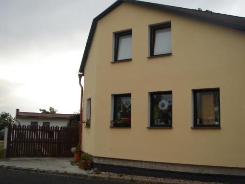 a house with four windows with a fan in it at Dům V Podzámčí in Mělník