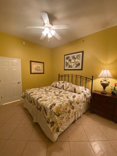 a bedroom with a bed and a ceiling fan at VacayFun Condos-Phoenix VII 004 in Orange Beach
