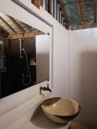 a bathroom with a wooden sink and a shower at Banpainamhomestay in Ban Huai Thalaeng Phan