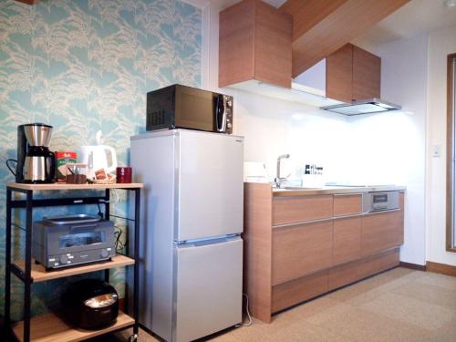 Virtuvė arba virtuvėlė apgyvendinimo įstaigoje K's House Hokkaido - Asahidake Onsen Hostel