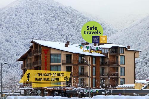 a hotel with a sign that reads safe travels at VERTEX SPA hotel in Estosadok