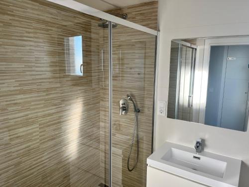 a bathroom with a shower and a sink at Sea View Apartment Arenal Beach Calpe in Calpe