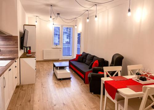 a living room with a couch and a table at Apartmán Rajecké Teplice in Žilina