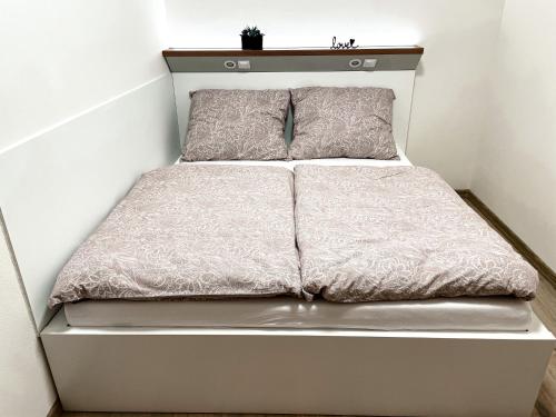 A bed or beds in a room at Apartmán Rajecké Teplice