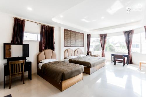 Postel nebo postele na pokoji v ubytování TY Holiday Resort