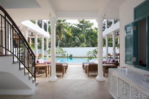 a view of a pool from the lobby of a house at Ginger Palm Villa in Hiriketiya
