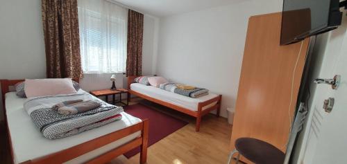 Postel nebo postele na pokoji v ubytování Apartments Martina