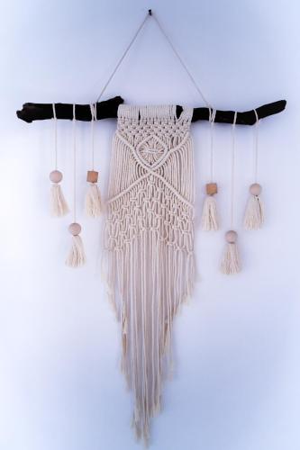 a bunch of fringeaments hanging on a wall at BOHO Hostel in Ko Lanta
