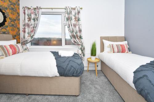 Voodi või voodid majutusasutuse A Cosy and Modern Mid-Terraced Retreat in Stoke! toas