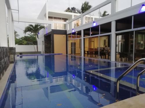 a view of a swimming pool in a building at Saara Beach Hotel in Marawila
