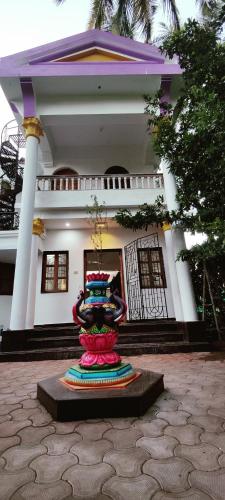 a vase sitting in front of a building at TantraLoka Retreat Centre in Arambol