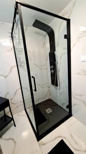 a mirror in a bathroom with a phone in it at Hakuna Matata in Nová Lesná