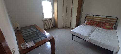 A bed or beds in a room at Appartamento mq 75 in zona riservata