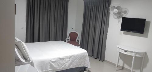Postel nebo postele na pokoji v ubytování Hotel Suite Santa Rosa