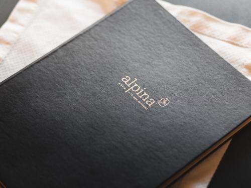 a black book with the word hudson on it at alpina&more APARTMENTS I ZIMMER in Serfaus