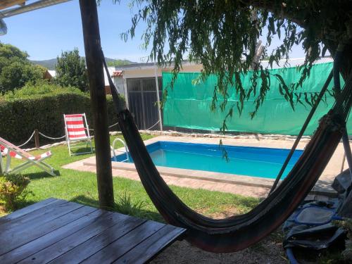 Bazén v ubytování Alquiler de Casa en La Falda nebo v jeho okolí