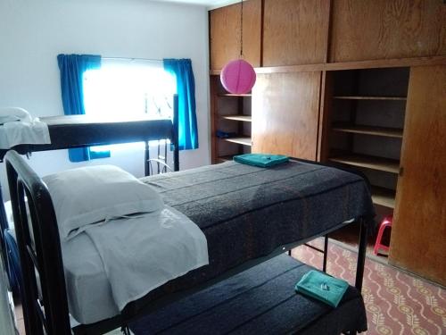 Ένα ή περισσότερα κρεβάτια σε δωμάτιο στο Hostal Azul Puebla