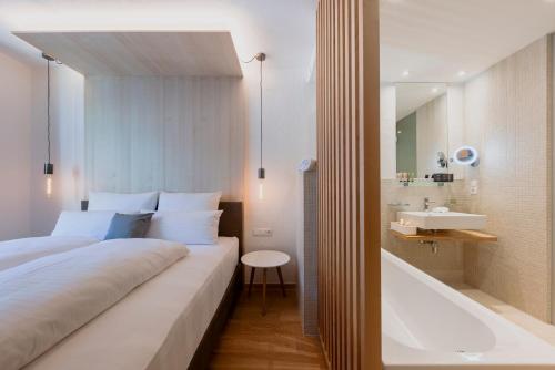 Una cama o camas en una habitación de MALI by m3