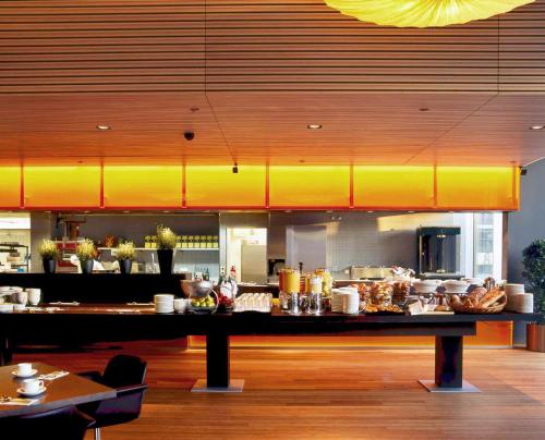 a kitchen with a counter with food on it at Radisson Blu Hotel, Lucerne in Luzern