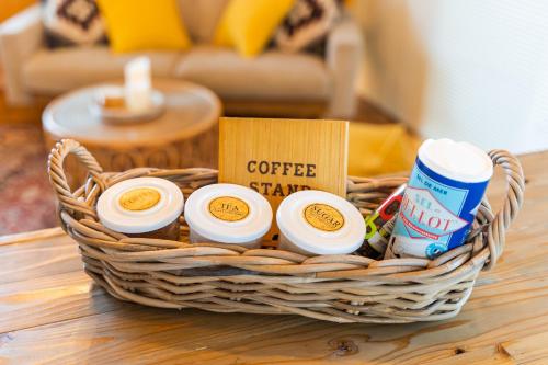 a basket with coffee stations on a table at SEA VIEW HOUSE KIRA KIRA HINANO in Nanjo