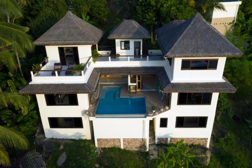an aerial view of a villa with a swimming pool at White Azure Villa Koh Phangan in Koh Phangan
