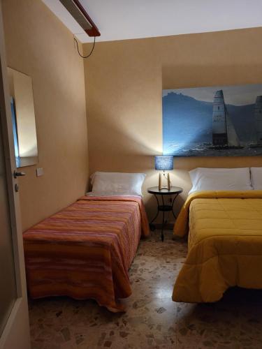 Postel nebo postele na pokoji v ubytování Mare Nostrum Petit Hôtel