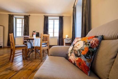 a living room with a couch and a table at Penzion Thallerův Dům in Český Krumlov