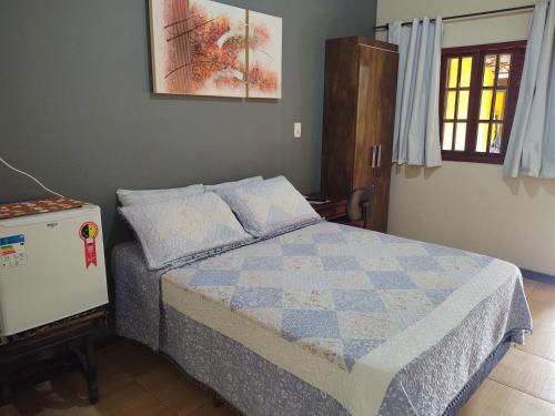 Postel nebo postele na pokoji v ubytování Hospedaria Raízes da Serra