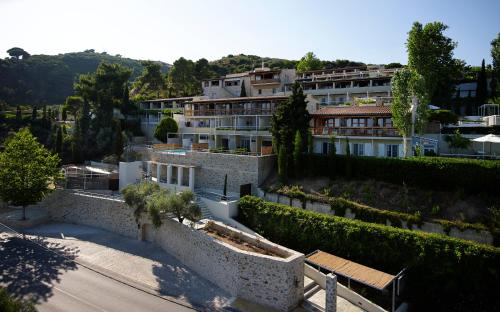 arial view of a building with bushes and trees at Atrium Hotel in Agia Paraskevi