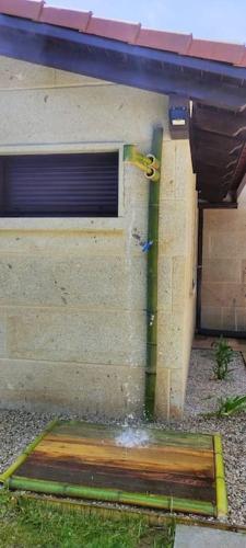 a building with a water pipe on the side of it at Casa nueva en Vigo Rural Mos con Jacuzzi y chimenea in Pontevedra