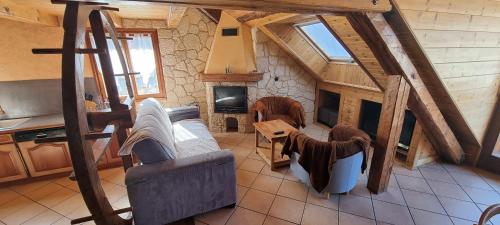an overhead view of a living room with a fireplace at Lou Francese in Ceillac