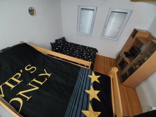 a bedroom with a bed with stars on it at Lakeview rest Home in Konjic