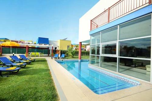 a large building with a swimming pool next to a building at Marina Sol by Atlantic Places in Albufeira