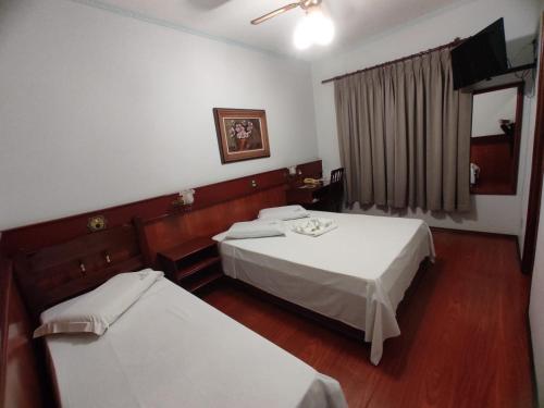 Postel nebo postele na pokoji v ubytování Js Palace Hotel