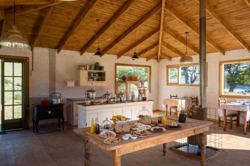a large kitchen with a table with food on it at Estancia Bonanza in El Chalten