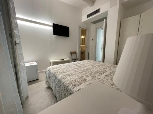 Кровать или кровати в номере Azzurramare Bed & Breakfast
