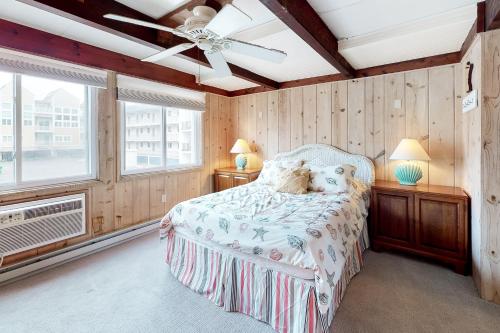 a bedroom with a bed and a ceiling fan at White Sands Village 27 in Ocean City