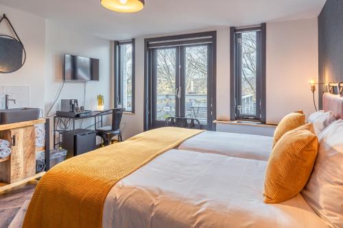 Ένα ή περισσότερα κρεβάτια σε δωμάτιο στο Hotel De Werf