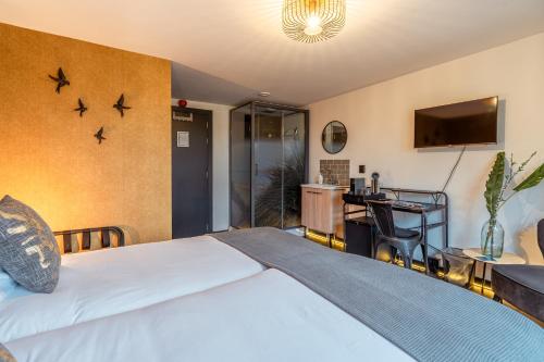 Ένα ή περισσότερα κρεβάτια σε δωμάτιο στο Hotel De Werf