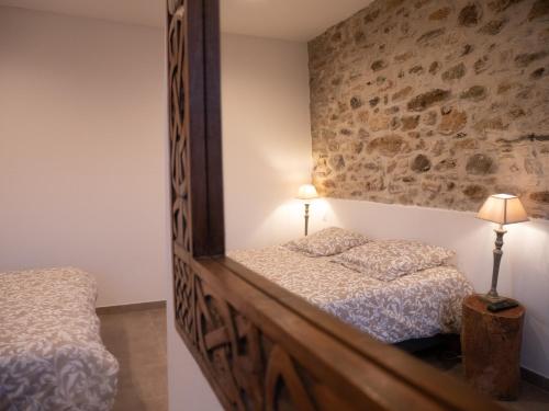 מיטה או מיטות בחדר ב-MULINU BIANCU