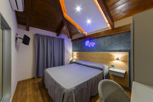 Postel nebo postele na pokoji v ubytování Hotel Vogue