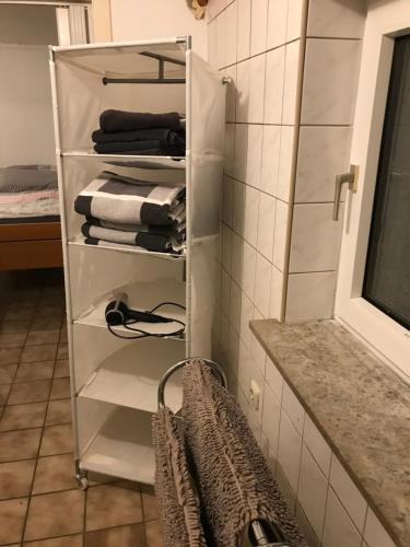 a towel rack in a bathroom with towels at Ferienwohnung Sandner in Porta Westfalica